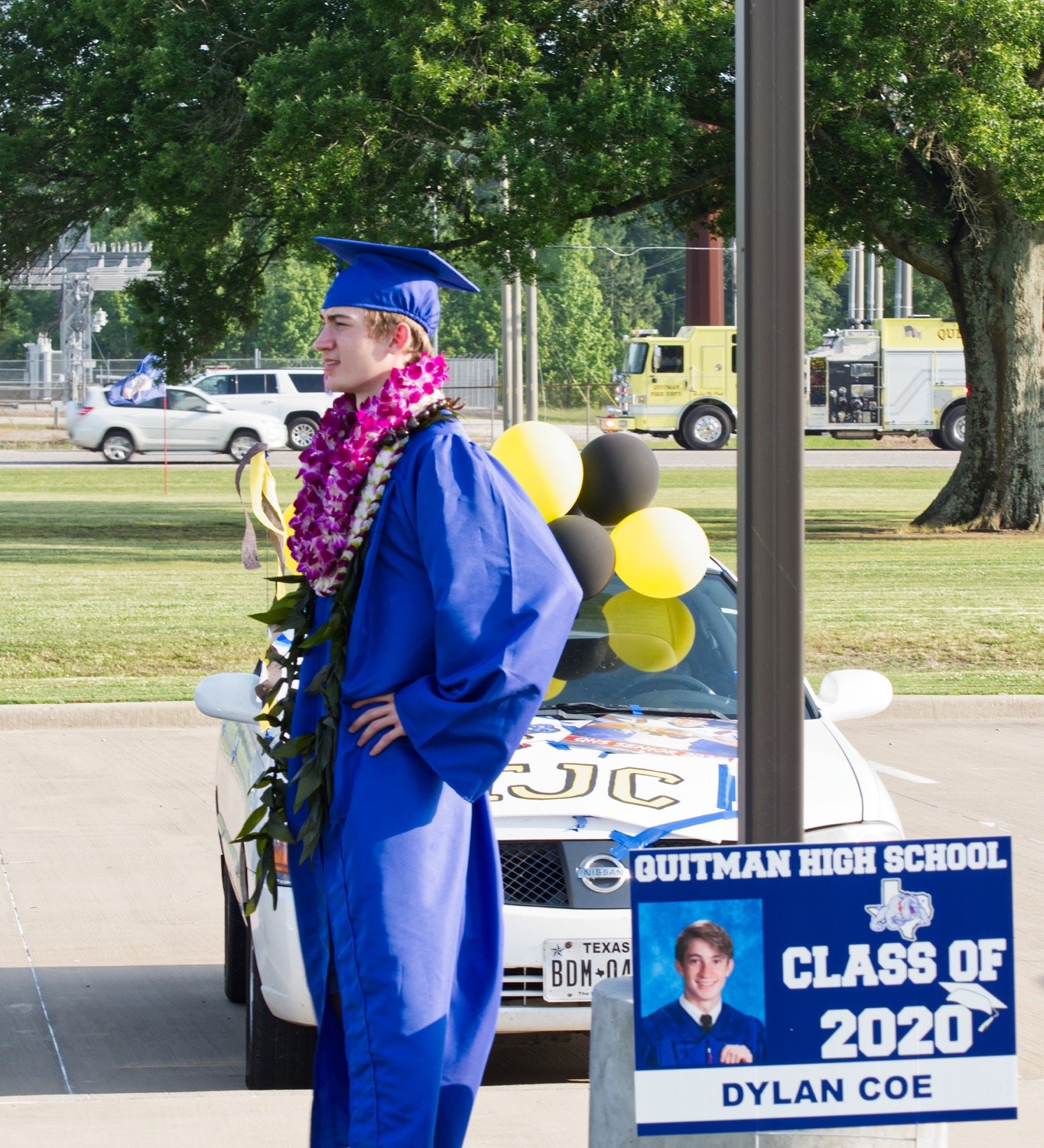 Quitman High School graduates wore the traditional cap and gown regalia for the reverse parade Thursday. A few added a little something to their outfit.